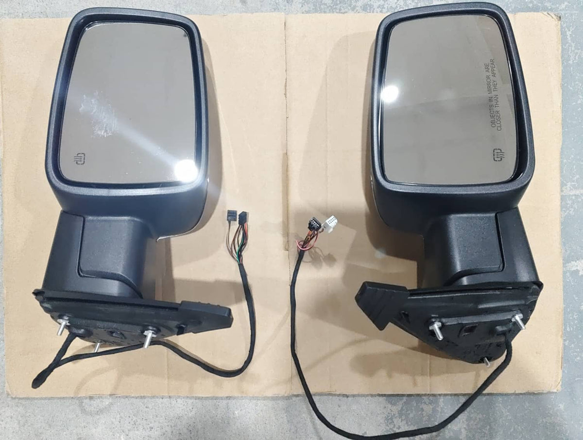 Black power-fold side mirrors with wiring harnesses, back view, pair