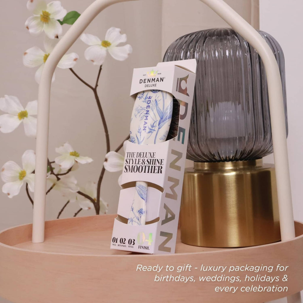 Denman hair brush and retail box with blue floral design and mixed bristles