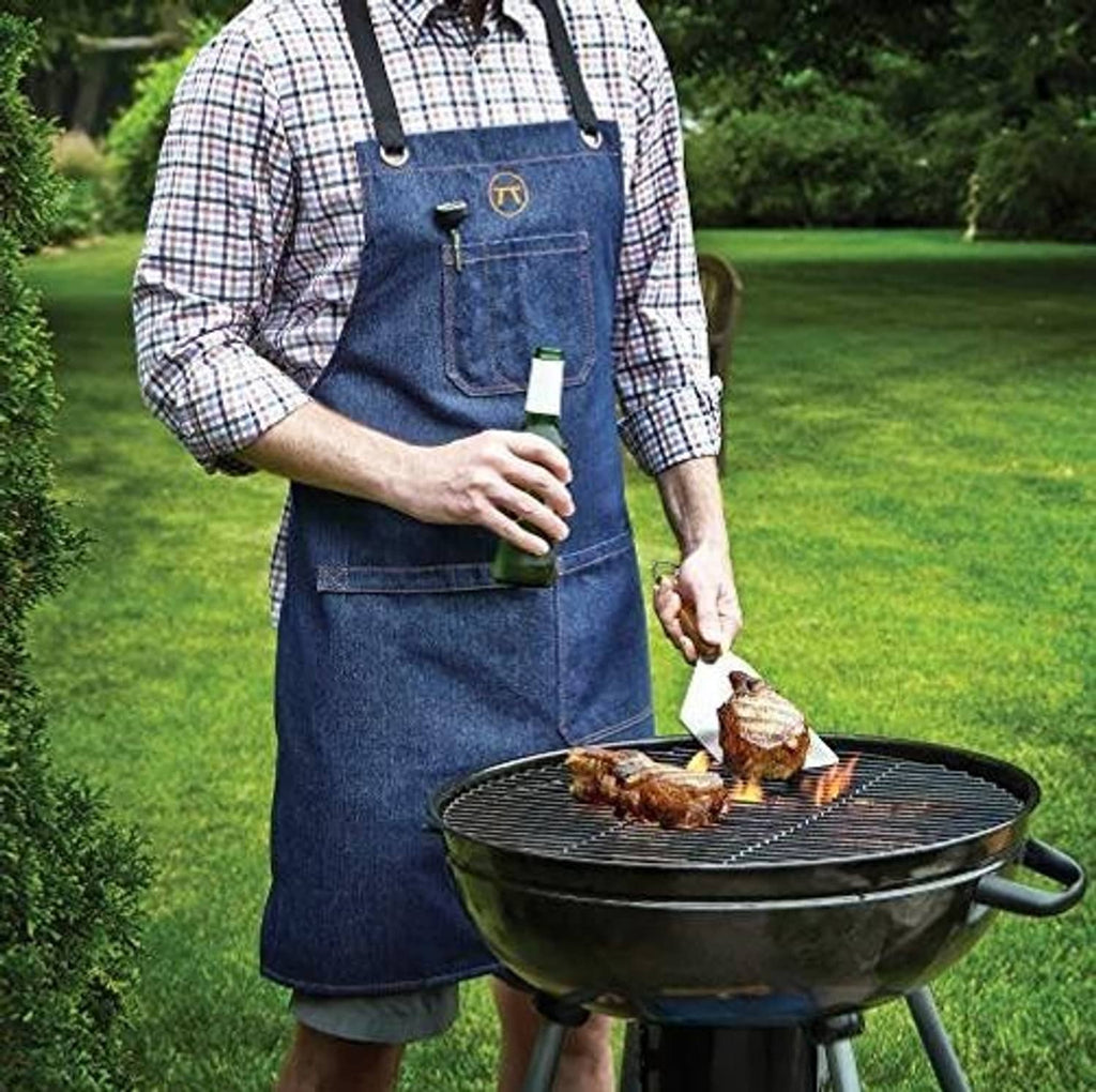 Blue denim cooking apron with two front pockets and cross-back straps