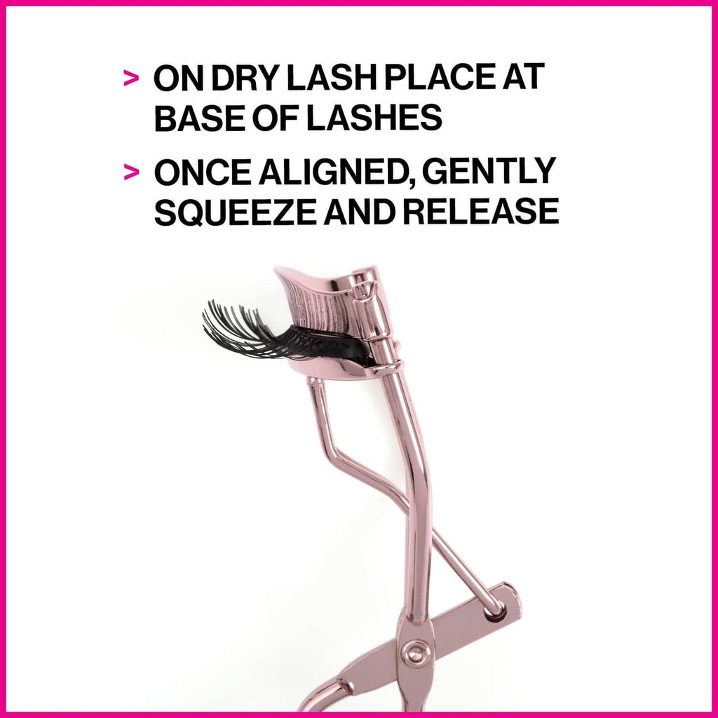 Rose gold eyelash curler standing with black pad