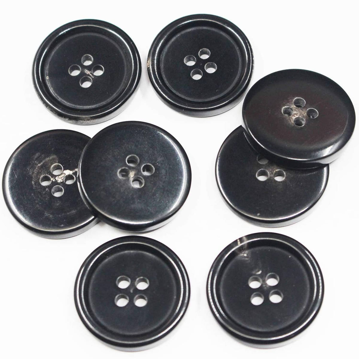 Black round 4-hole buttons, mixed layout, set of 11