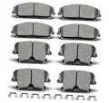 Ceramic brake pad set with clips, multiple front and rear pads shown in gray
