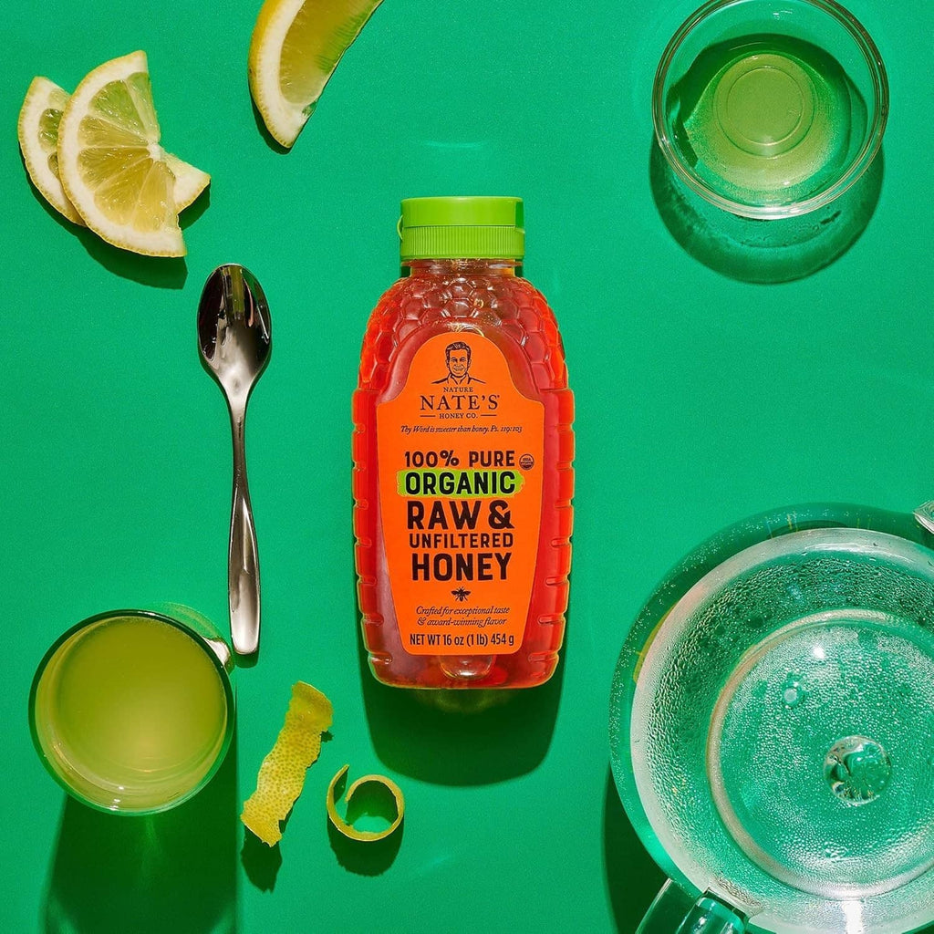 Nate's organic raw & unfiltered honey bottle with green cap, amber contents
