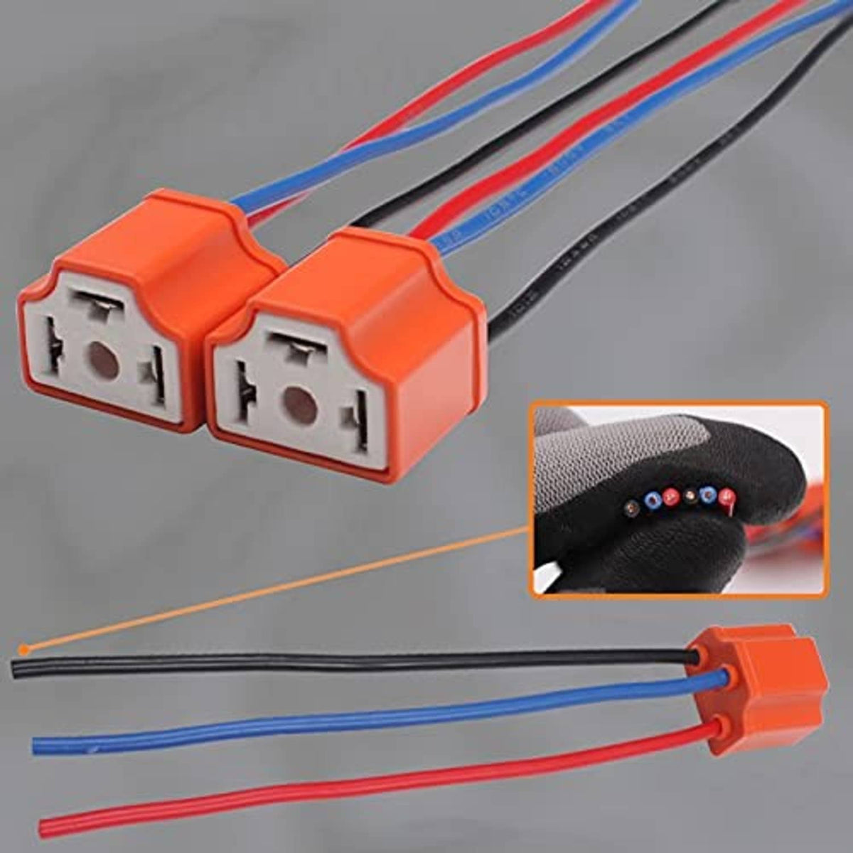 Pair of H4 female plug pigtails with orange housings and multicolor wires, side angle