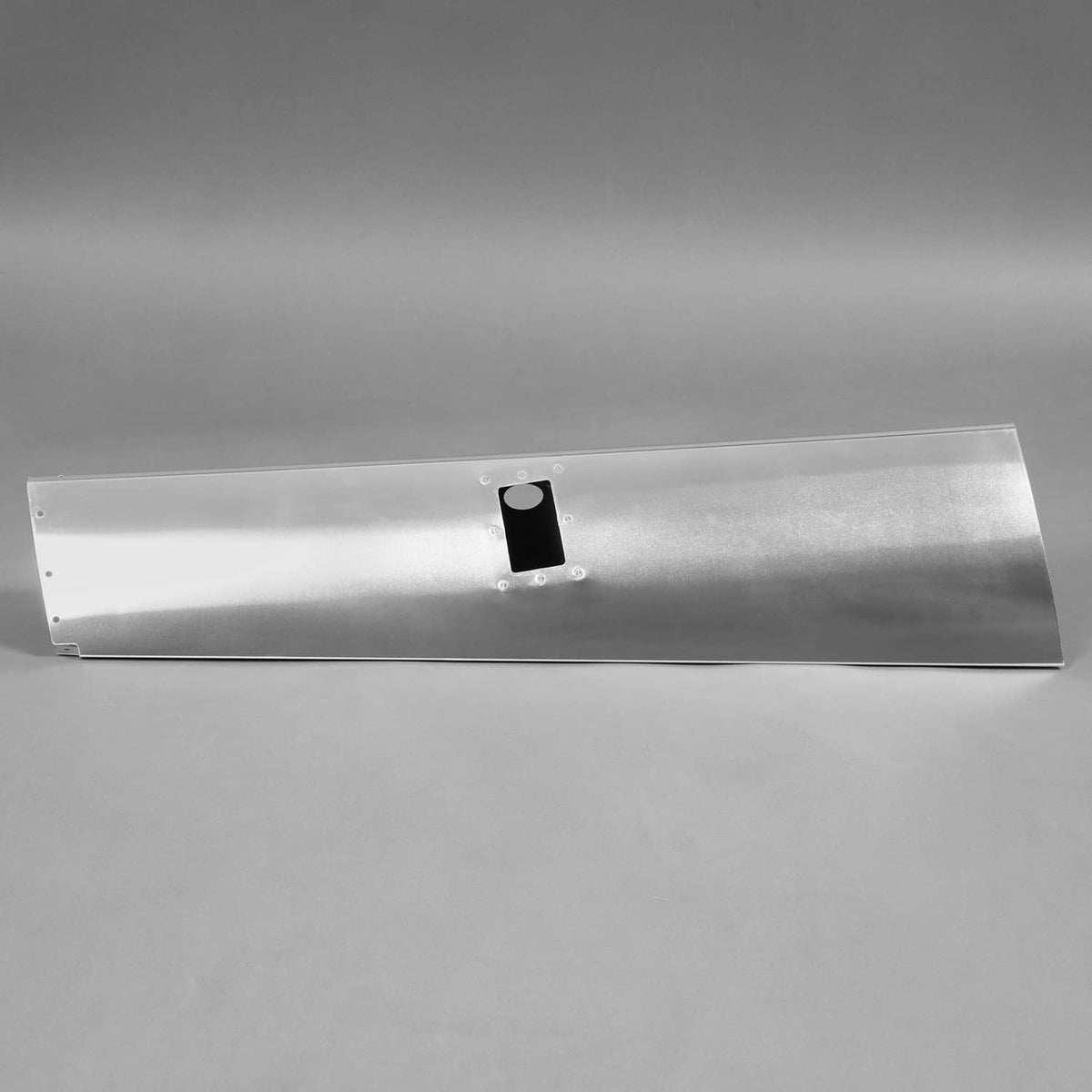 Polished aluminum landing gear leg fairing panel with centered bracket plate