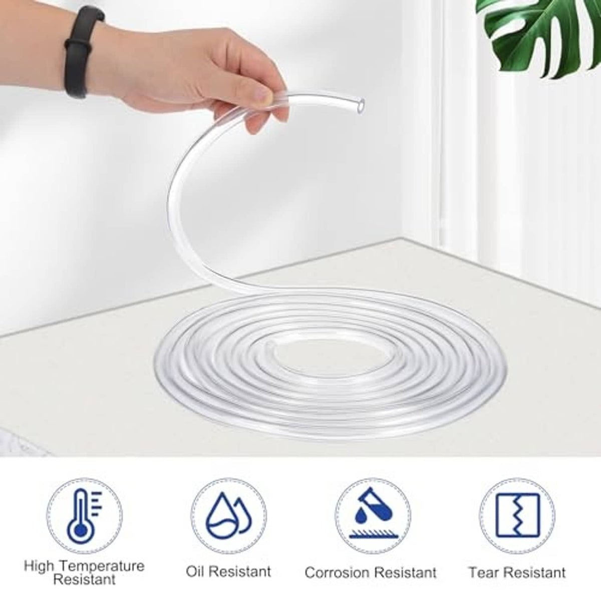 Flexible clear PVC drain hose with end opening, coiled tubing on a flat surface