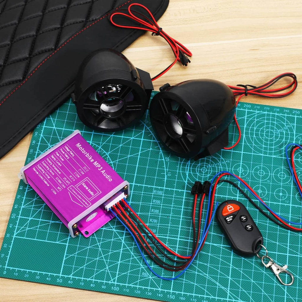 Motorcycle audio kit: two black speakers, purple controller, remote key fob, wires