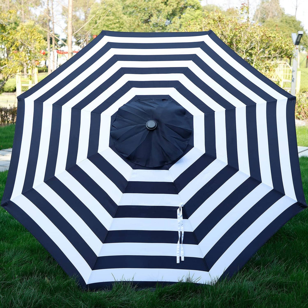 Navy and white striped patio umbrella canopy with round center cap