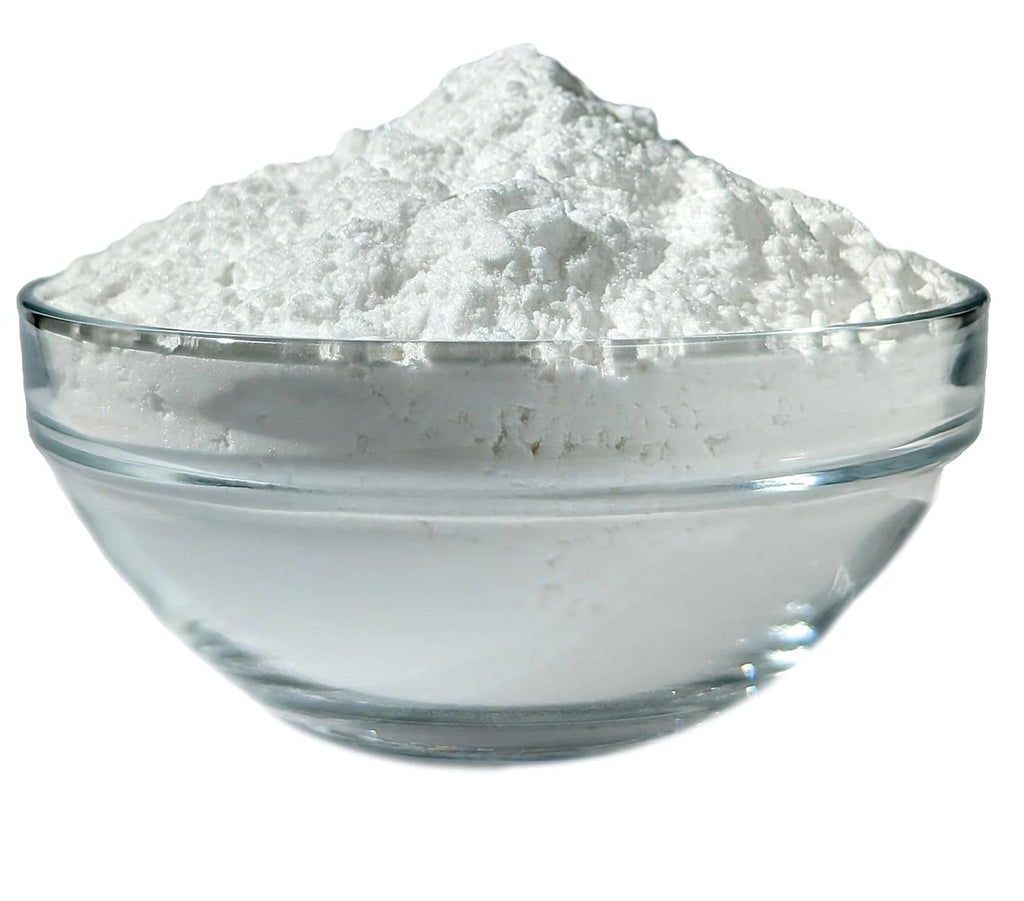 Glass bowl filled with white potato starch powder.