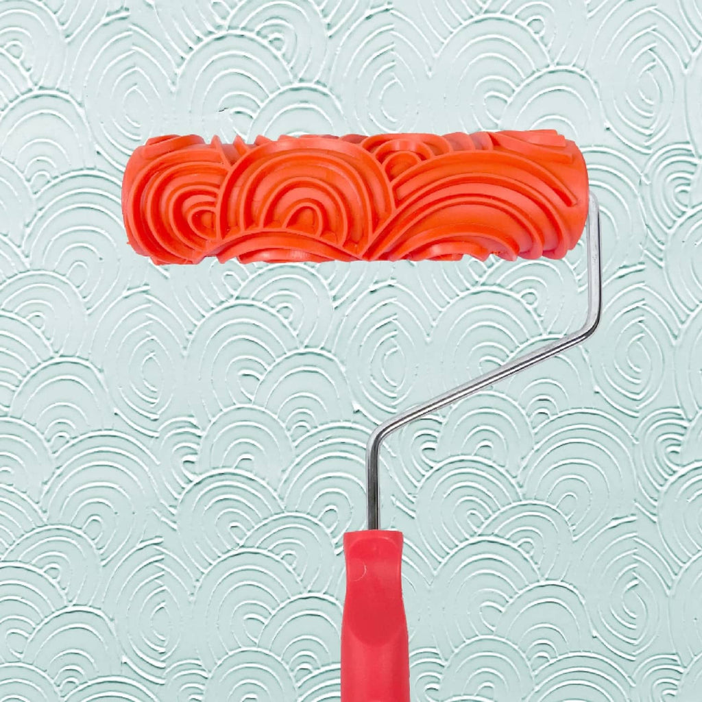 Orange patterned paint roller with raised brick texture roller head