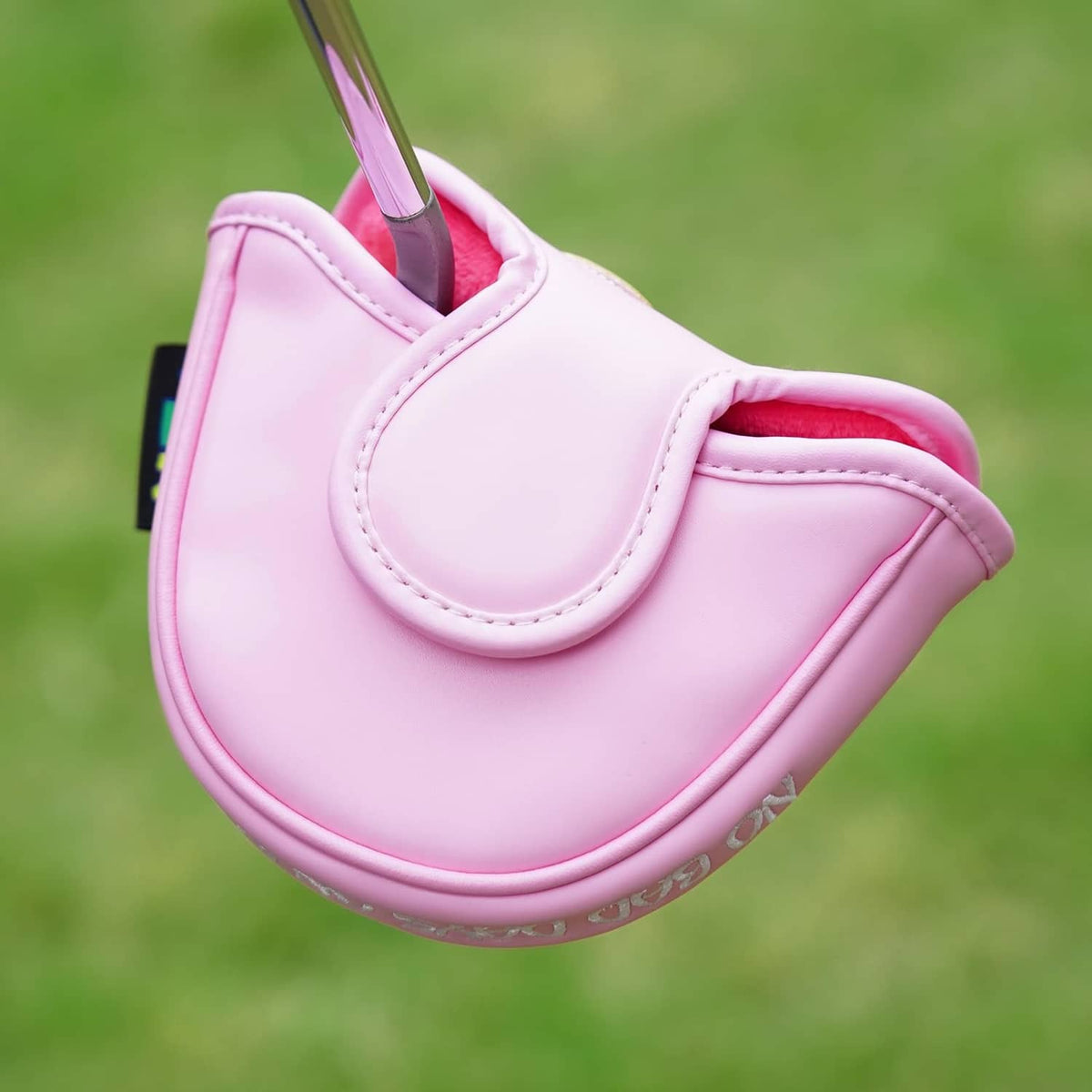 Pink mallet putter cover with curved top opening and stitched handle loop.
