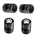 Black tire valve stem cap set with paw-print emblem and textured knurled body