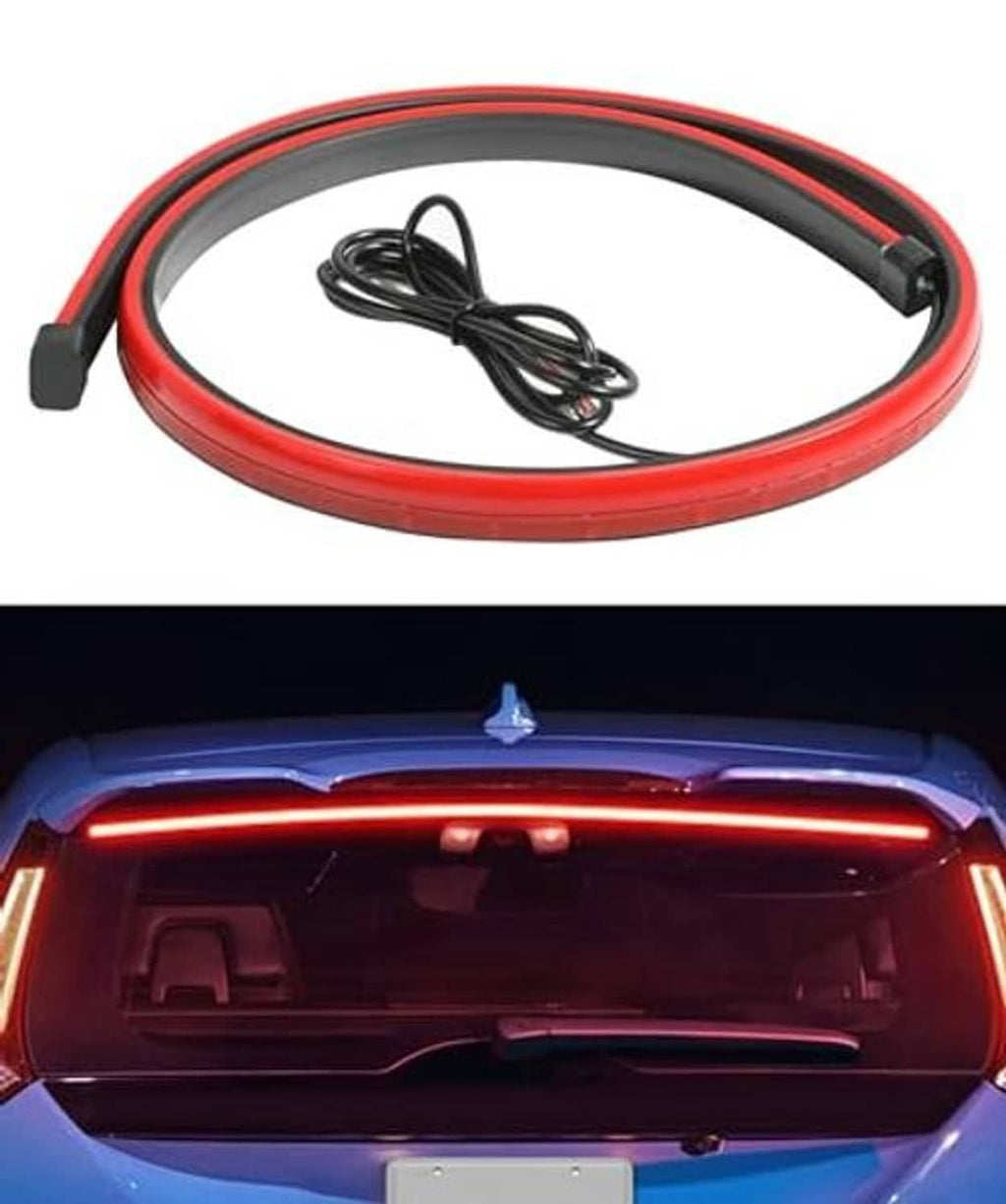 Red 3rd brake LED strip glowing along the rear, with connected wiring