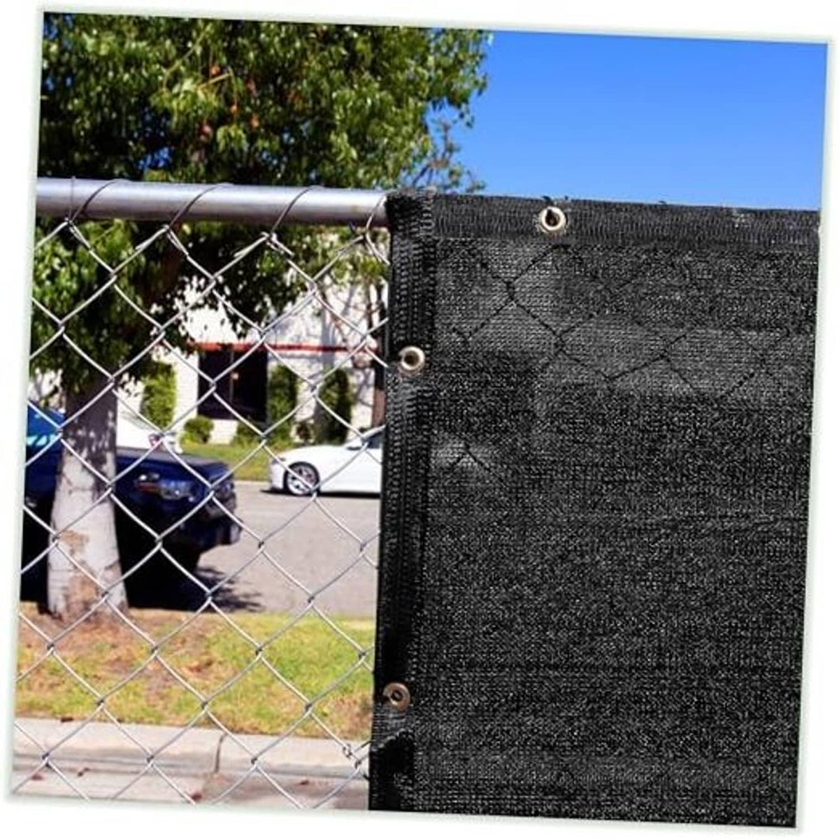 Black shade cloth tarp panel with reinforced grommets along the edge