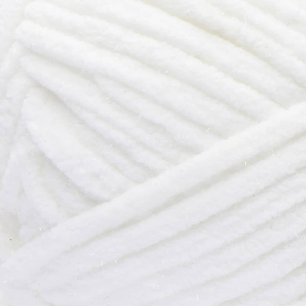 Close-up of white super bulky yarn strands with subtle sparkle texture