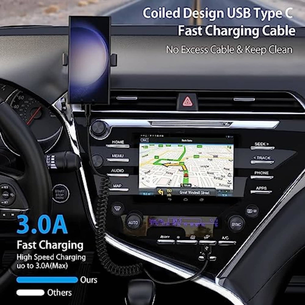 Black coiled USB-A to USB-C car charging cable connected in dashboard setup.