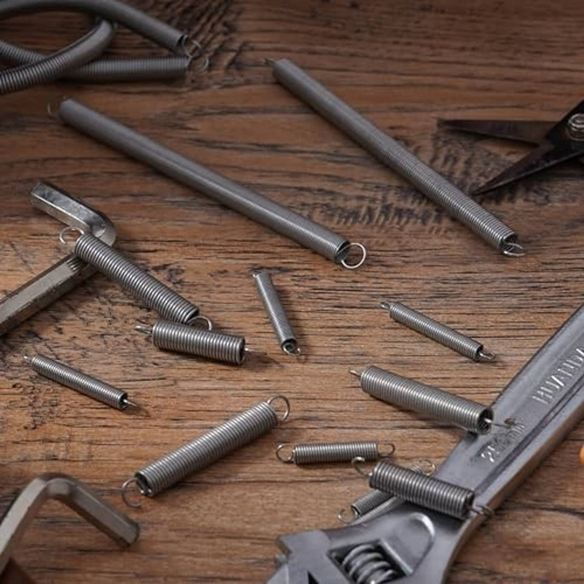 Multiple stainless extension springs with coil bodies and loop end hooks