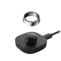 Black Oura Gen3 charging dock with metal ring top and cable