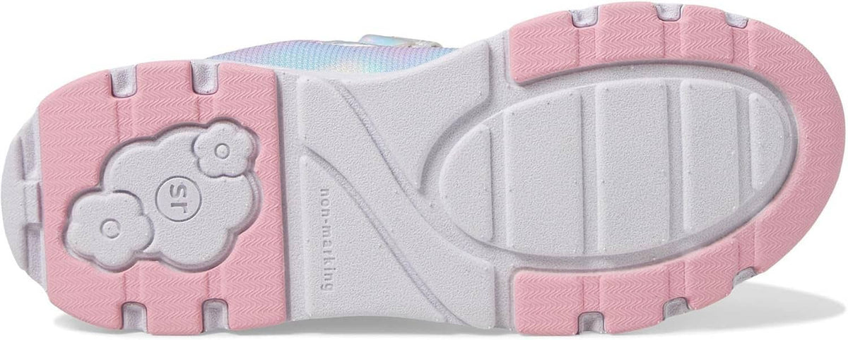 Kids sneaker outsole with grippy tread and light gray rubber pods over pink base.