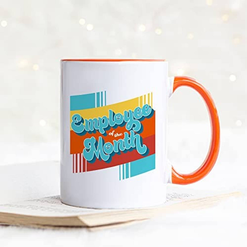 White ceramic mug with orange handle and 'Employee of the Month' graphic
