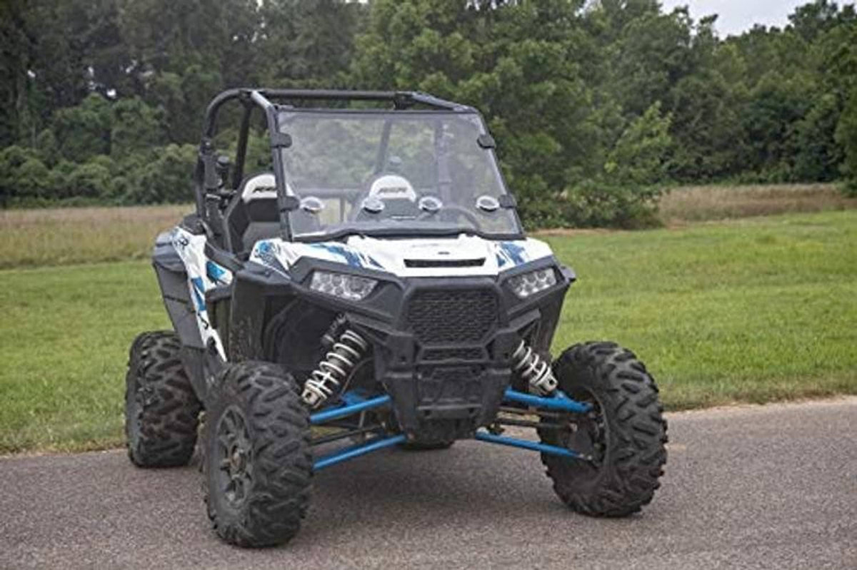 Front view of UTV with tinted full windshield and black mounting frame outdoors