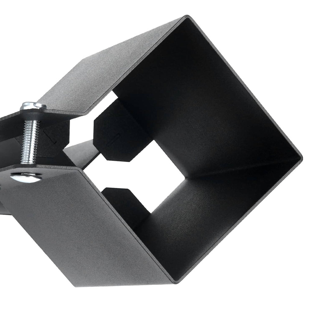 Black metal anchor bracket for ground spikes, showing bolt holes and welded plate