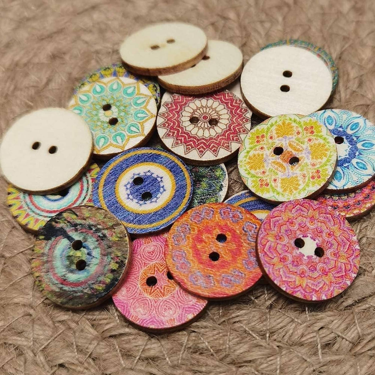 Round wood craft buttons with colorful random patterns and 2-hole fronts.