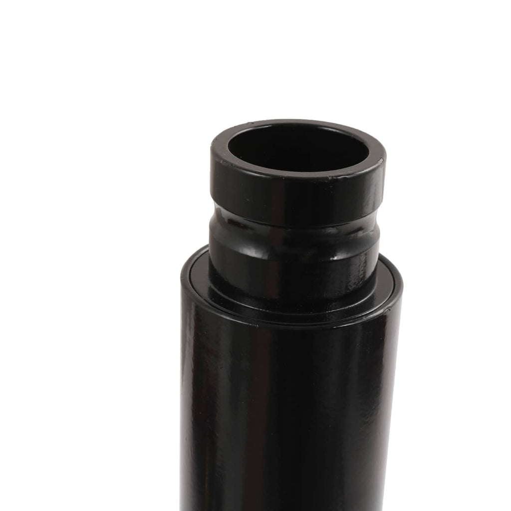 Black shock absorber body end cap with circular opening.