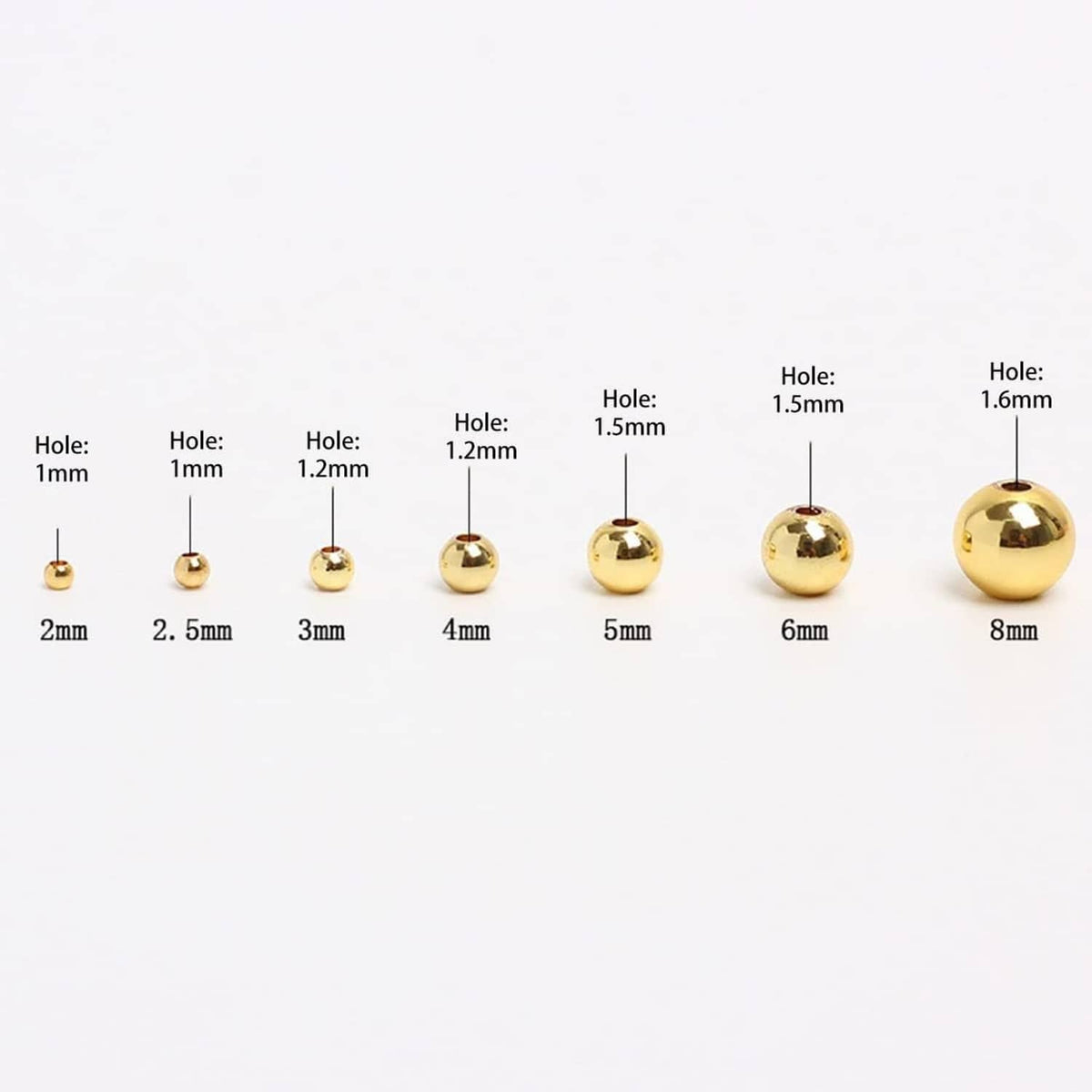 Assorted 14K rose gold filled rondel beads shown by hole size, 1mm to 1.6mm