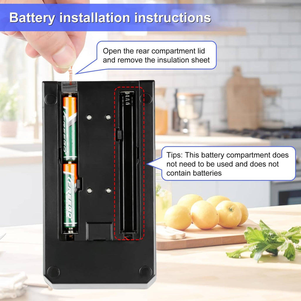 Black milligram scale with open battery compartment and inserted battery