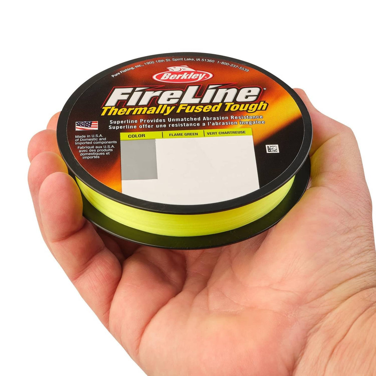Berkley FireLine braided fishing line spool in hand, neon yellow-green line