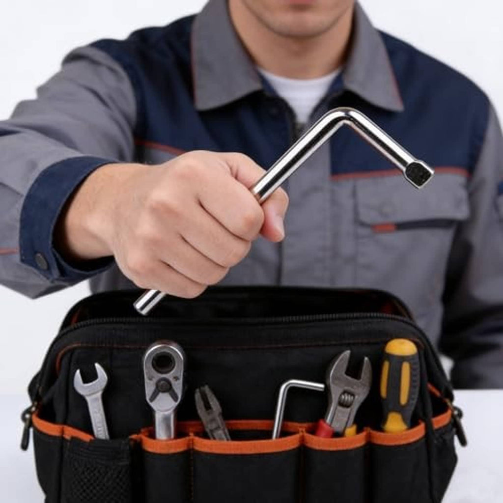 Chrome L-handle wrench held in hand, with vehicle tool pouch in view