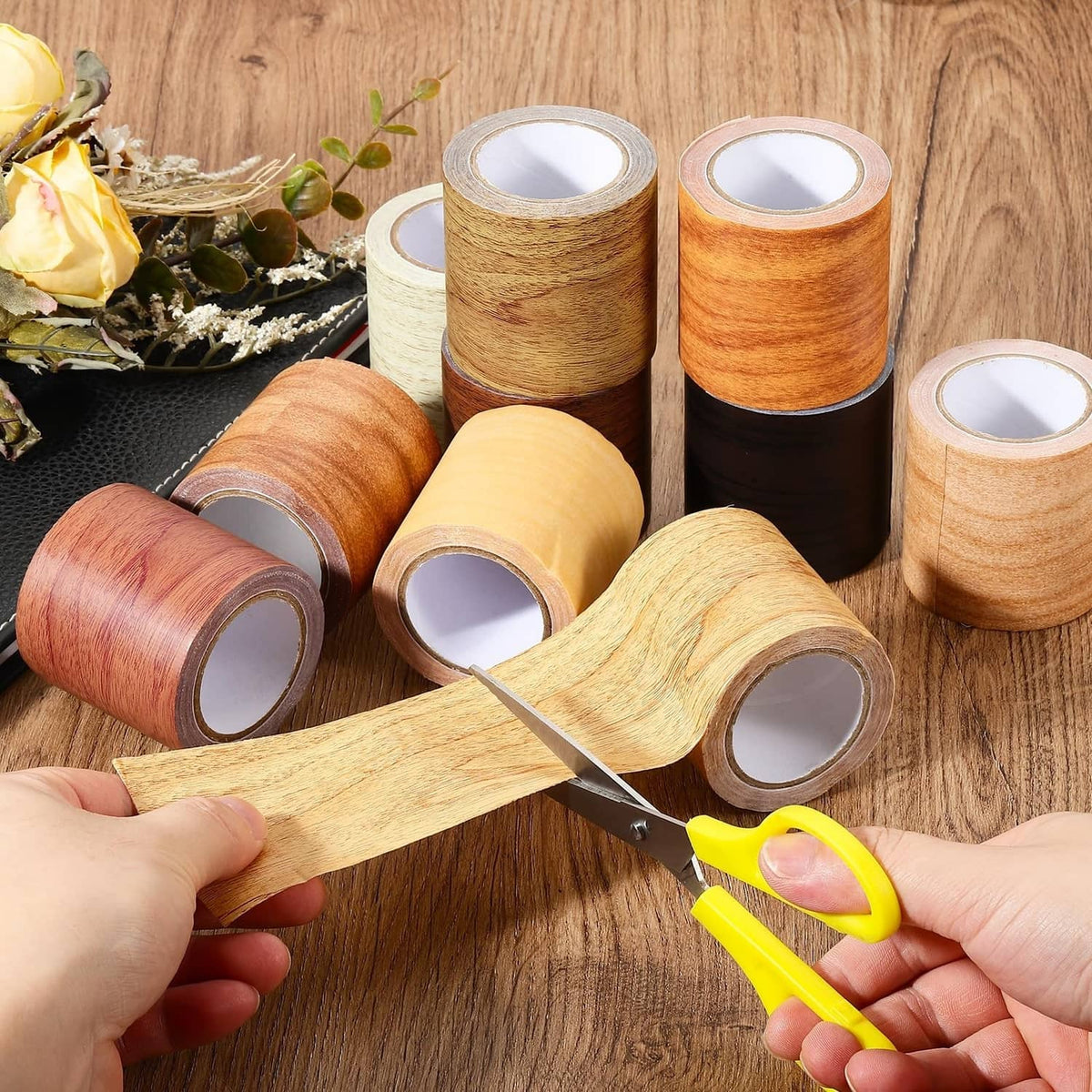 Set of self-adhesive wood-grain tape rolls in multiple warm wood tones