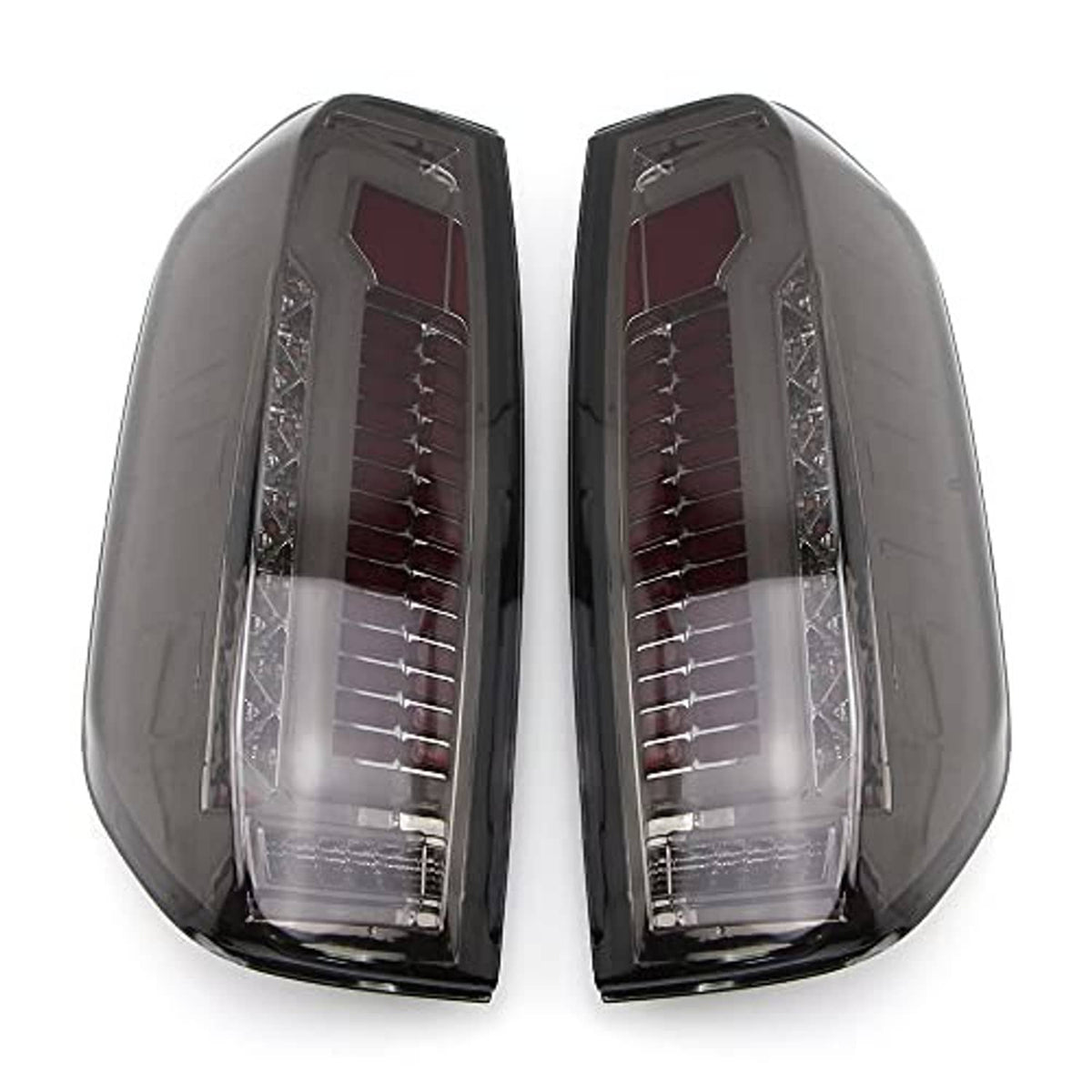 Pair of LED tail light housings with clear outer lens and red reflector elements, black finish