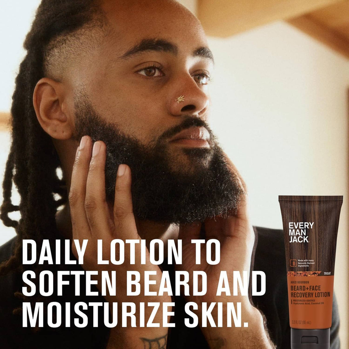 Beard-and-face recovery lotion tube near a bearded man’s face