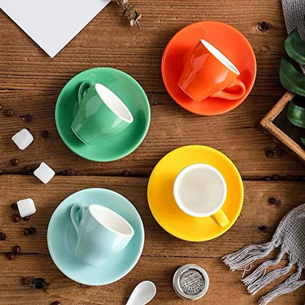 Mixed-color porcelain espresso cups with matching saucers in a set