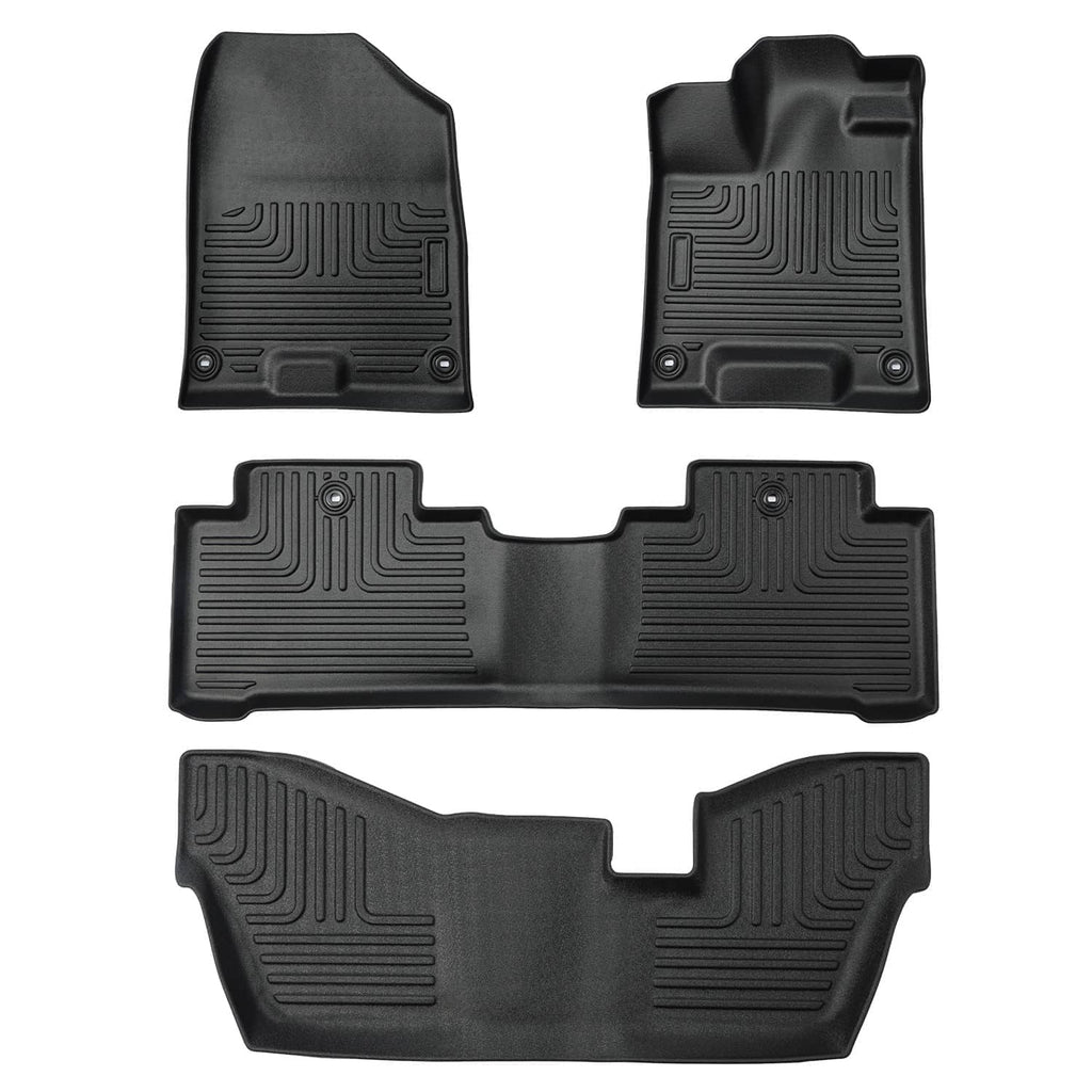 Black TPE front and rear floor mats with raised patterns and anchor holes