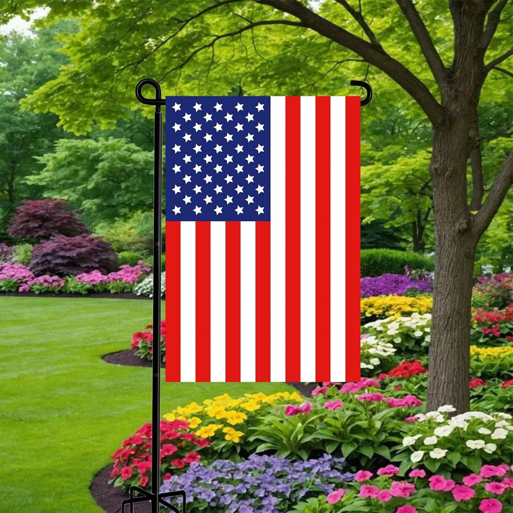 Black flag stand pole with top hooks and five-prong base holding a garden flag