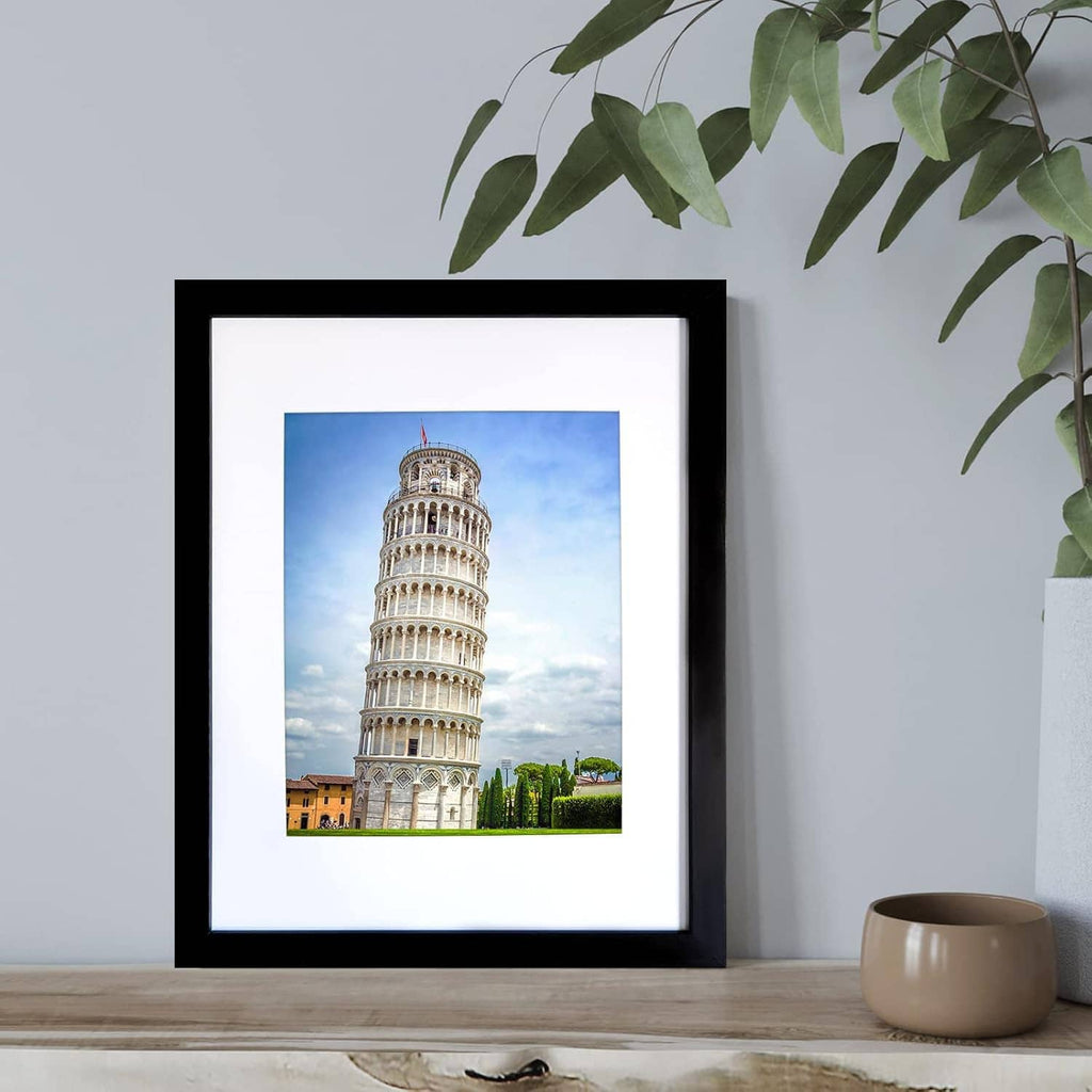 Black picture frame with white mat holding a photo of the Leaning Tower of Pisa.
