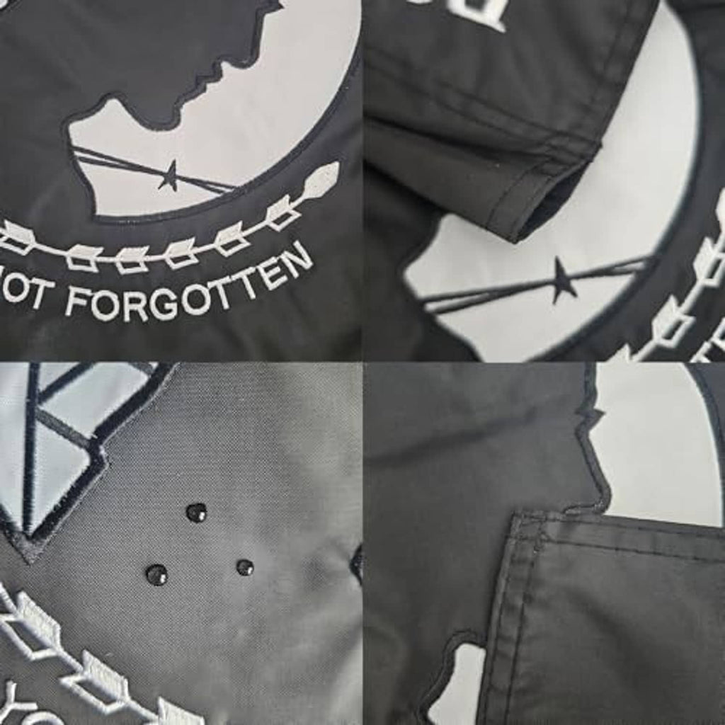 Double-sided embroidered garden flag close-up, dark gray POW*MIA stitched graphics