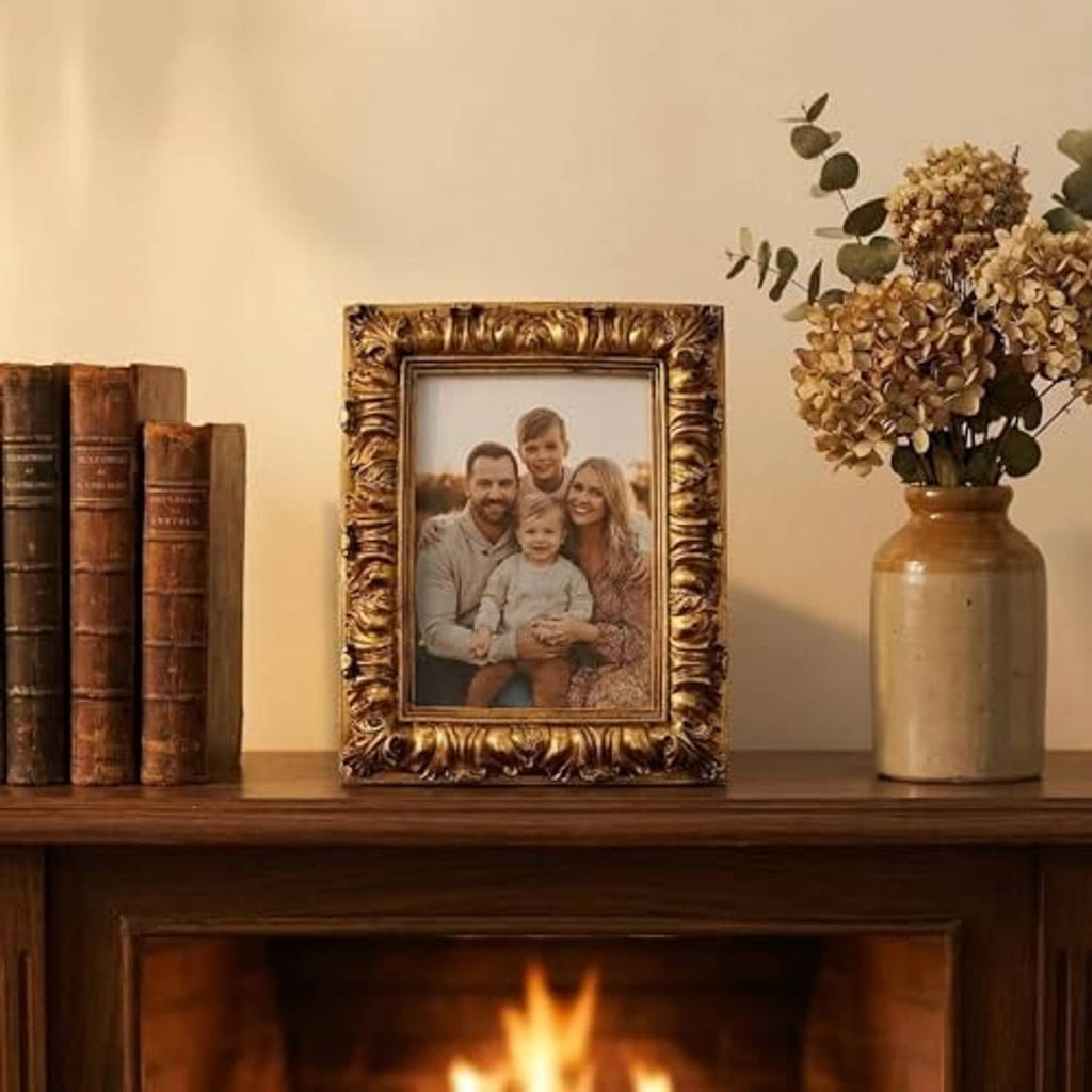 Ornate antique gold picture frame with family portrait photo