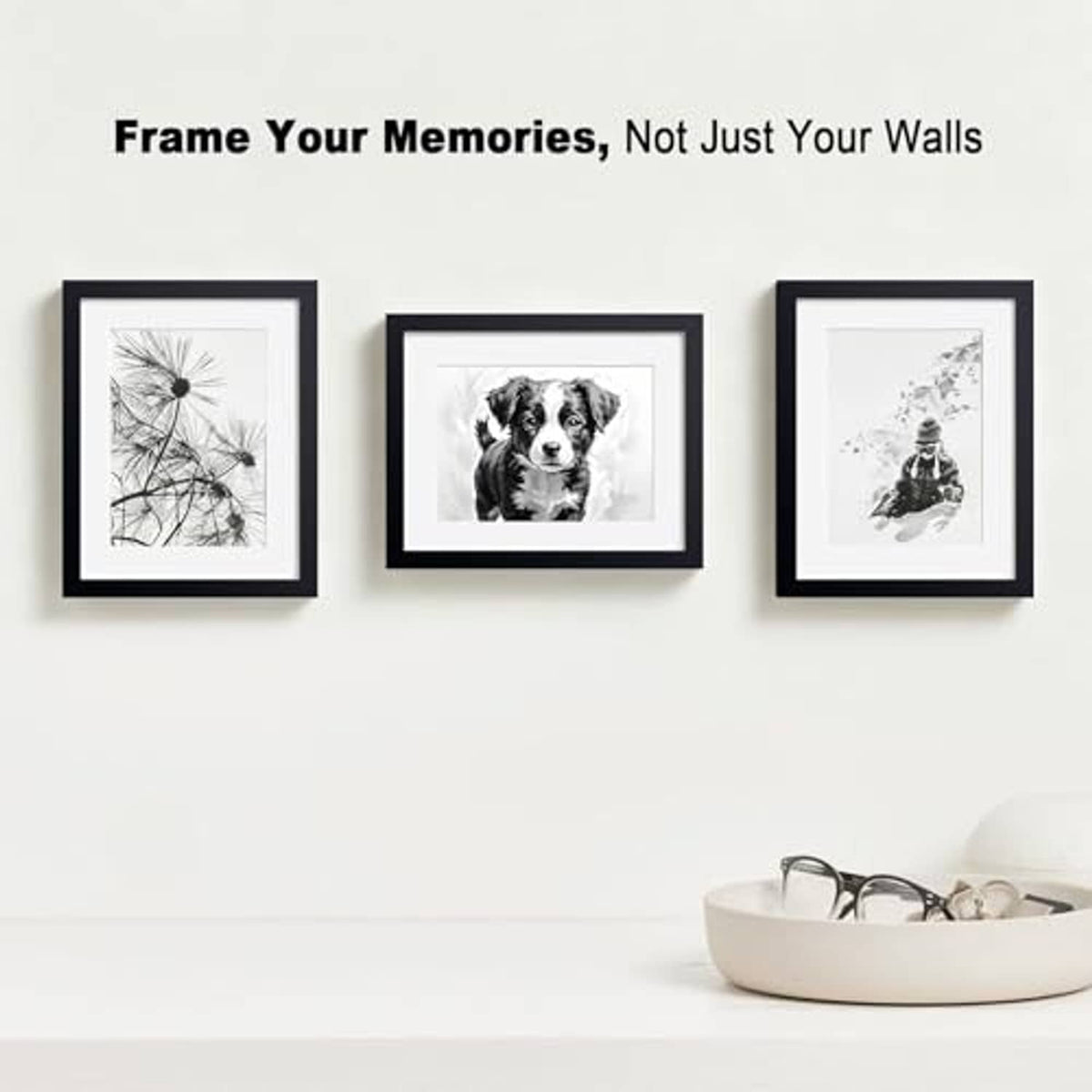 Three black wooden picture frames with white mat and clear glass, wall display