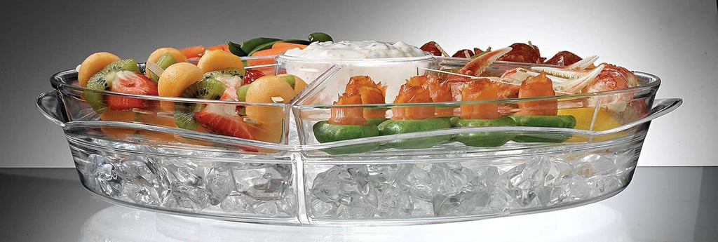 Clear 16-inch round appetizer ice tray with hinged lids filled with mixed appetizers