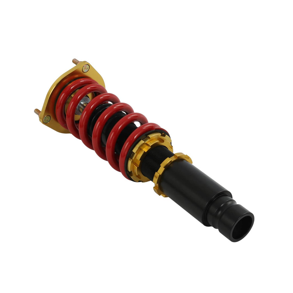 Single coilover close-up with red spring, black damper, gold collar and top mount