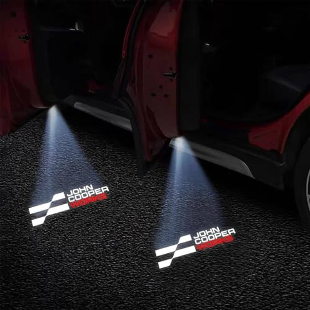 Car door projector LEDs casting white logo pattern on dark floor