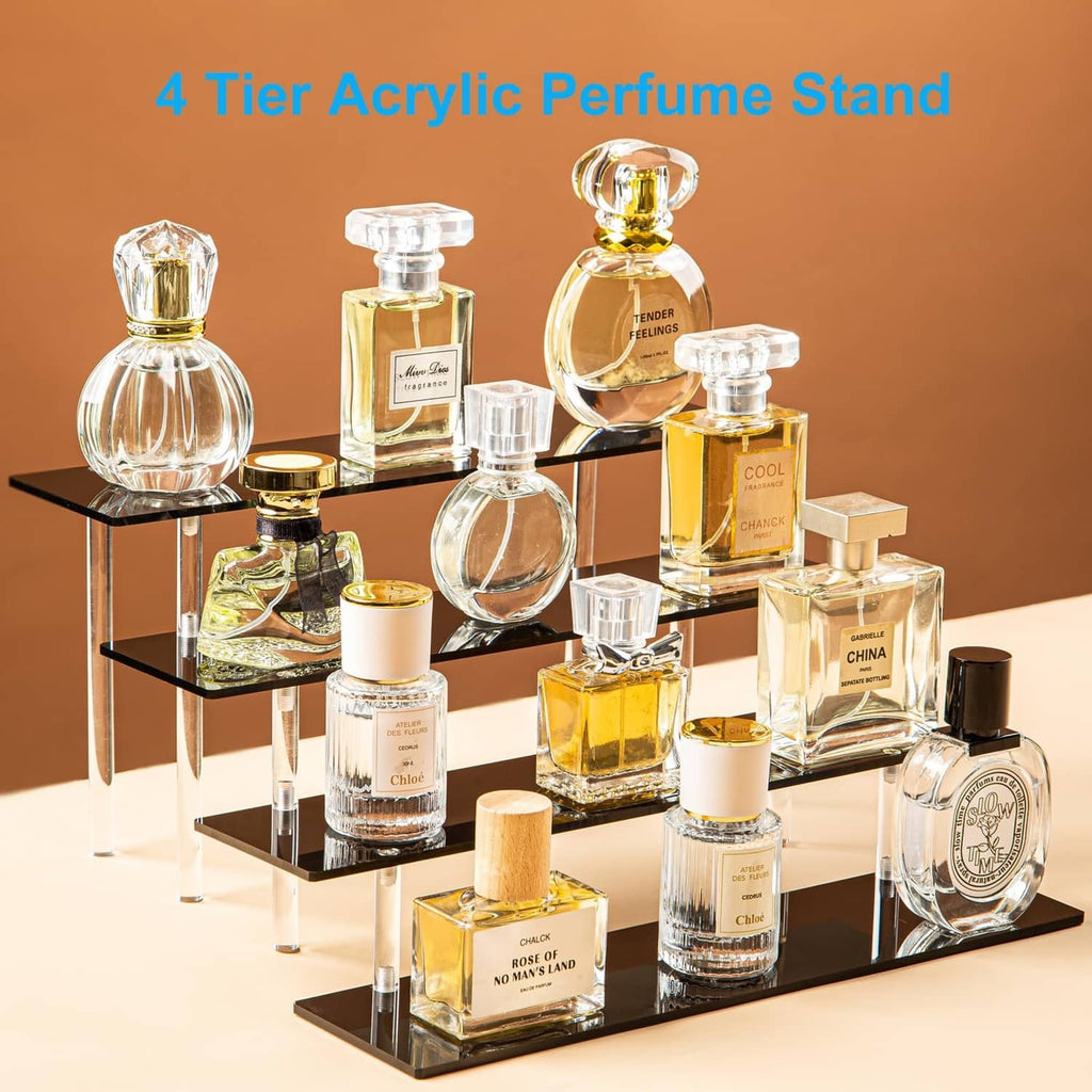 4-tier acrylic display stand with black shelves holding perfume bottles