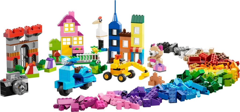 Multicolor LEGO brick creations, including vehicles and house models
