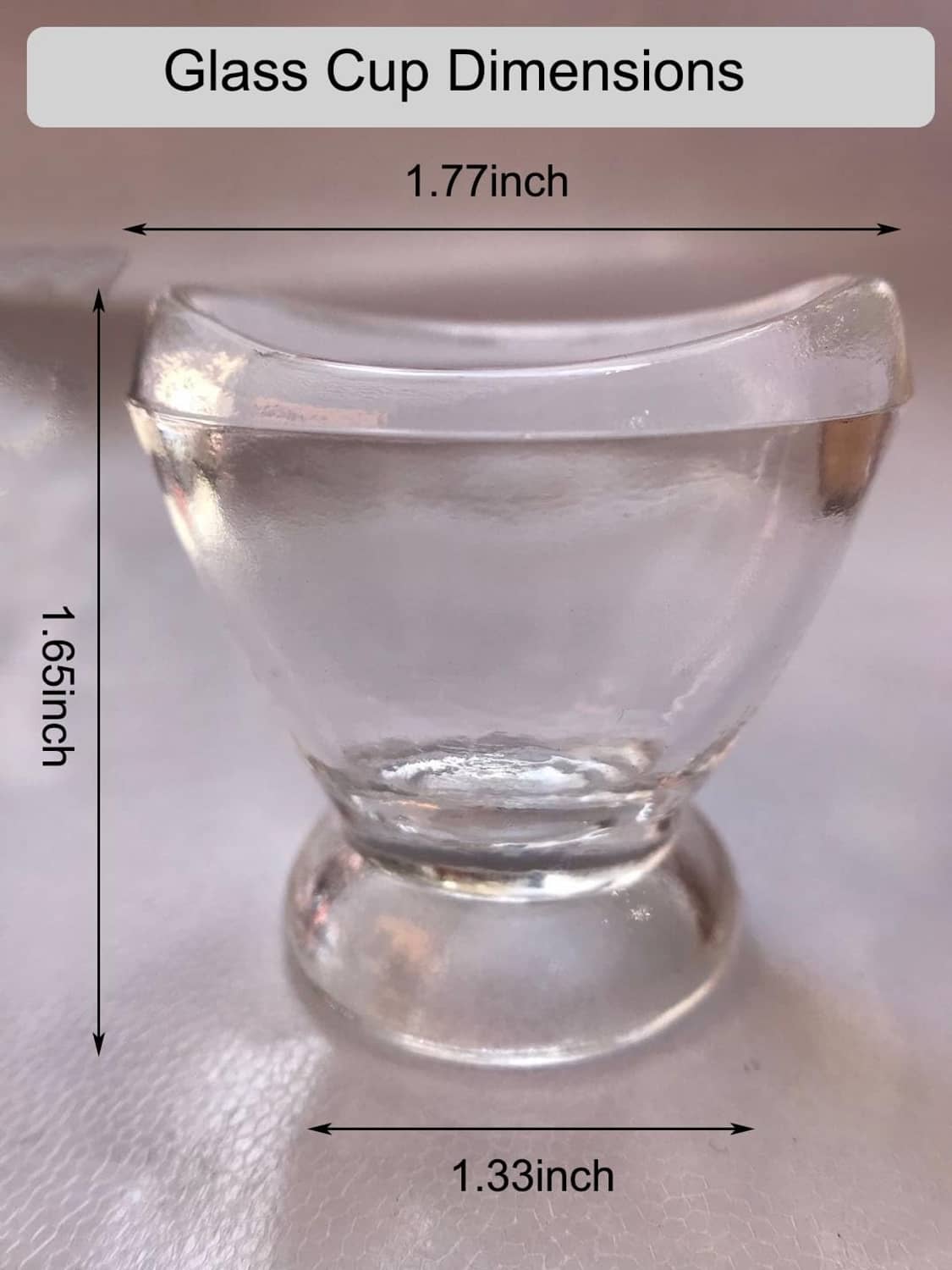 Clear glass eye rinse cup size diagram, 1.77 in by 1.33 in