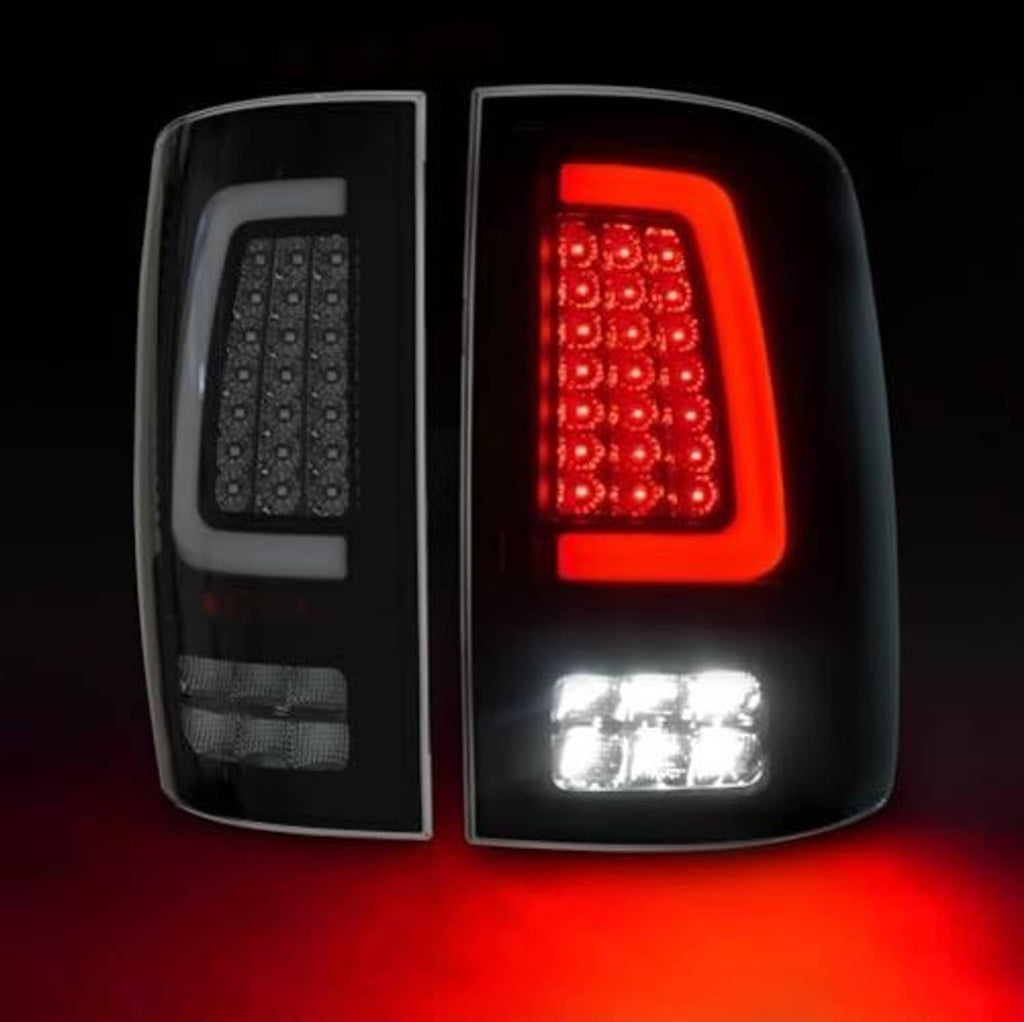 Rear LED tail light assembly with red LED array and white reverse LED strip