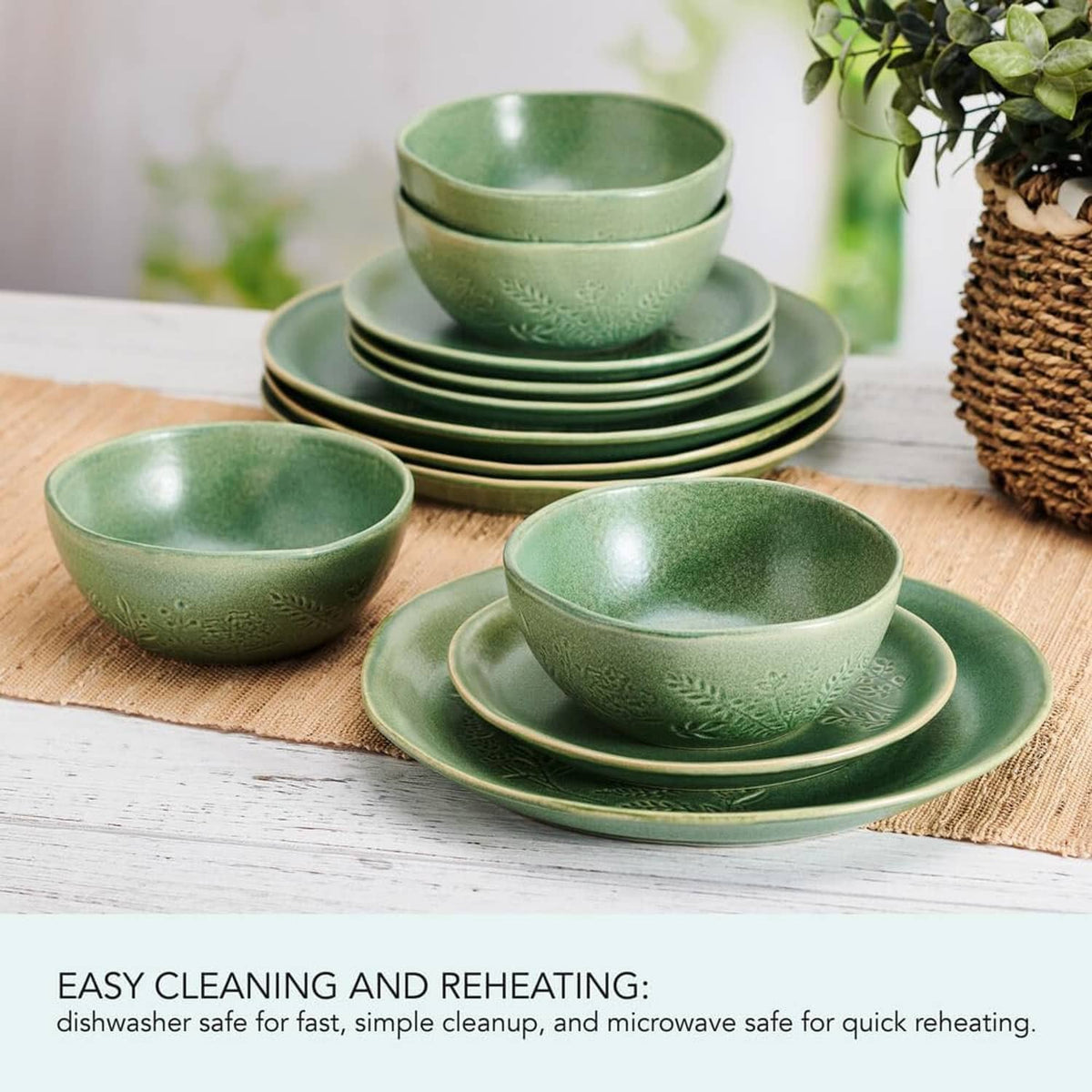 Green embossed dinner bowls and plates set arranged on a table surface